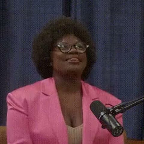 Dr. Raven Baxter at a studio microphone