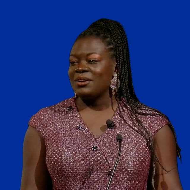 Dr. Raven Baxter hosting from the lectern at the International Space Station Research & Development Conference
