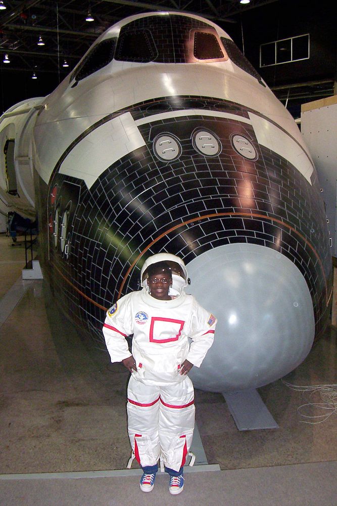 Raven beside a space shuttle model in 2004