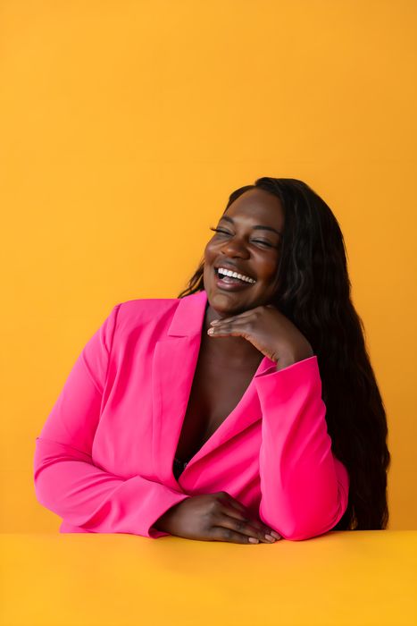 Studio · pink blazer on yellow